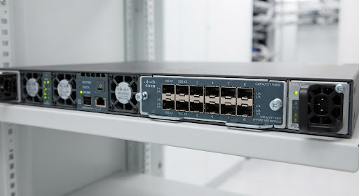 Detailed view of Cisco Catalyst 9300 modular uplink bay populated with high-speed 8-port 10G SFP+ expansion network card